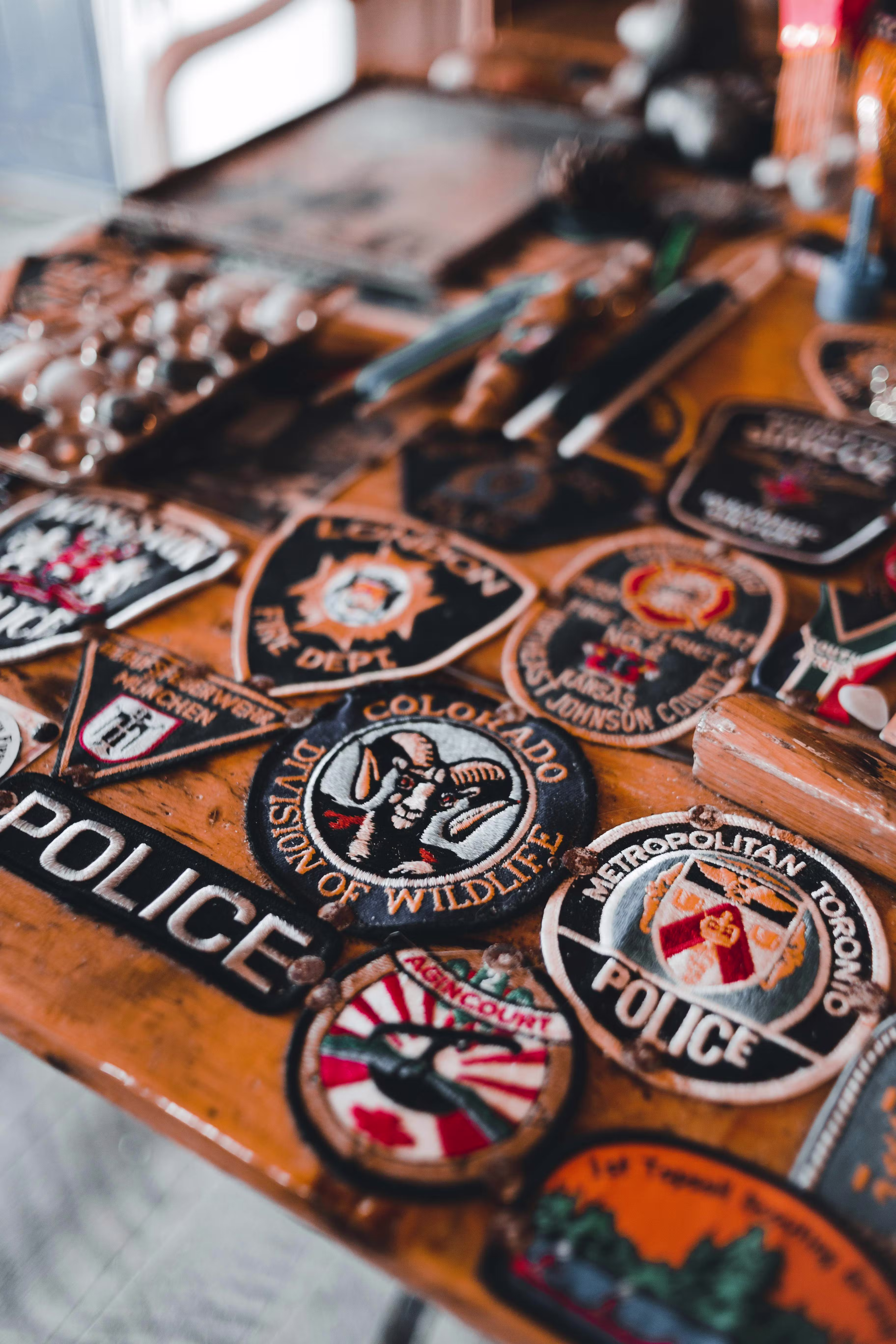 a collection of mainly police patches laying on a table